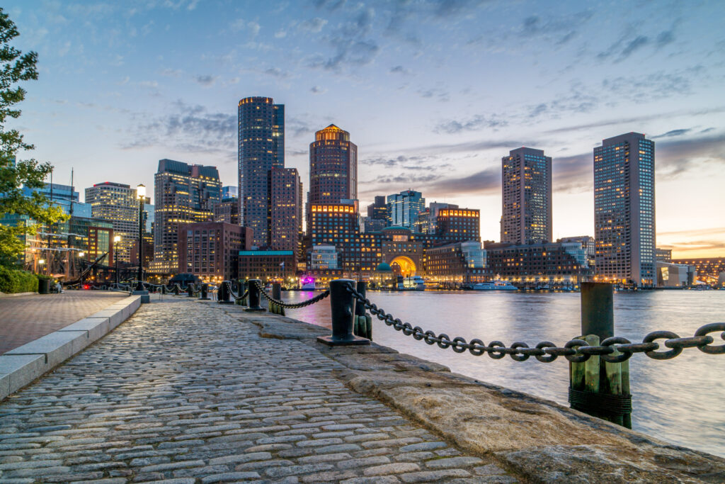 Boston Harbor and Financial District view from harbor on downtown, cityscape at sunset, Massachusetts, USA